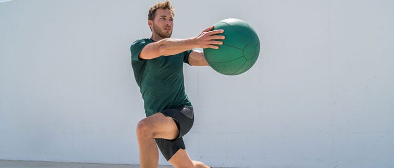 man stretching with ball